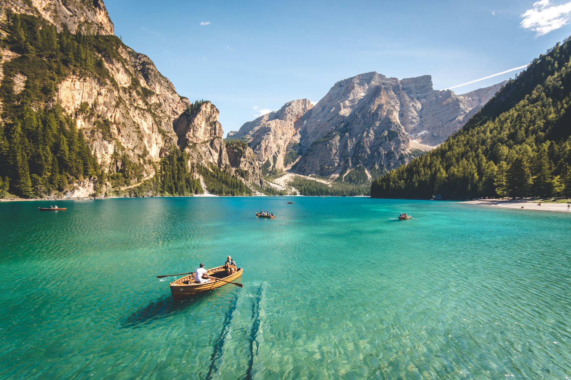 Mountain range reflected in a calm lake at dawn